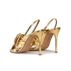 Baroque Bow detailed gold high heel sandals in metallic leather