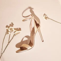 Martina Ankle-strap high heeled sandals in gold metallic leather