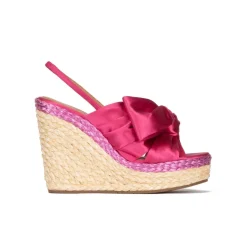 Miquela Bow detailed wedge sandals in fuchsia satin