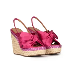 Miquela Bow detailed wedge sandals in fuchsia satin