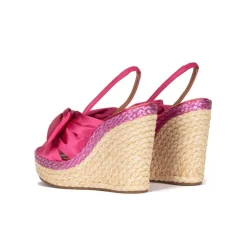 Miquela Bow detailed wedge sandals in fuchsia satin