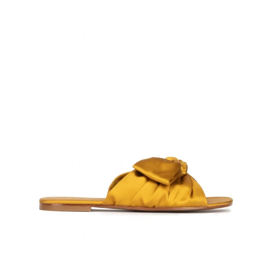 Quetty Bow detailed flat sandals in mustard satin