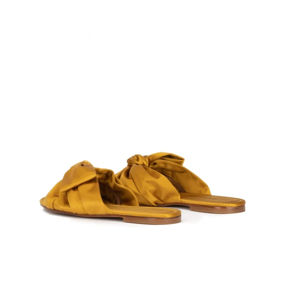 Quetty Bow detailed flat sandals in mustard satin